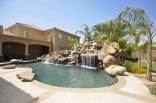 Pool with waterfall of custom home in Phoenix, Arizona
